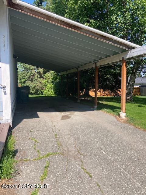 2531 W 79th Ave, Anchorage, AK 99502 - view of vehicle parking featuring asphalt driveway and an attached carport