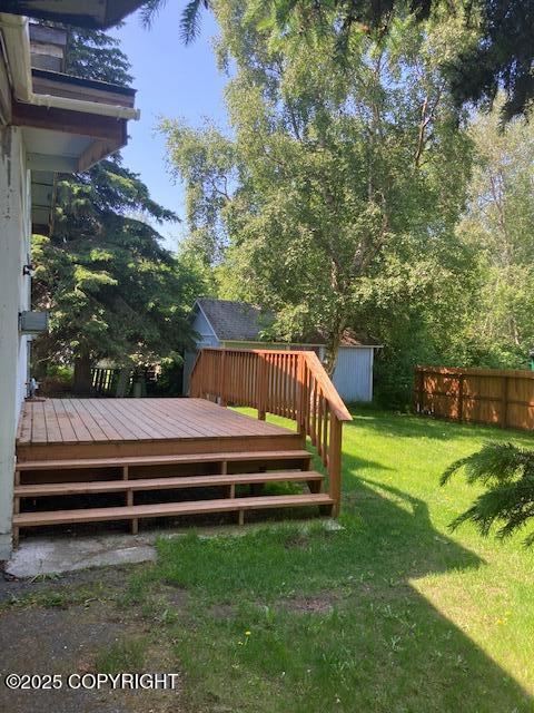 2531 W 79th Ave, Anchorage, AK 99502 - view of yard with a deck and a storage unit