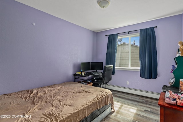 1119 Alder Ave, Kenai, AK 99611 - bedroom with a baseboard radiator and wood finished floors