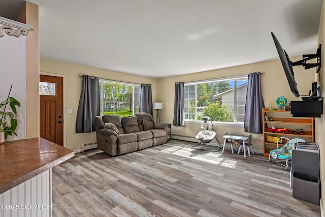 1119 Alder Ave, Kenai, AK 99611 - living room featuring a baseboard radiator and light wood-style floors
