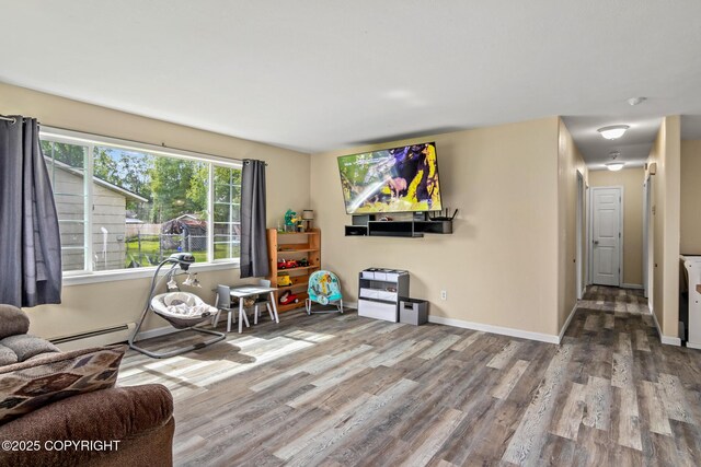 1119 Alder Ave, Kenai, AK 99611 - living room with wood finished floors and a baseboard radiator
