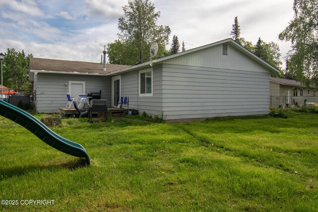 1119 Alder Ave, Kenai, AK 99611 - back of property with a playground and a yard