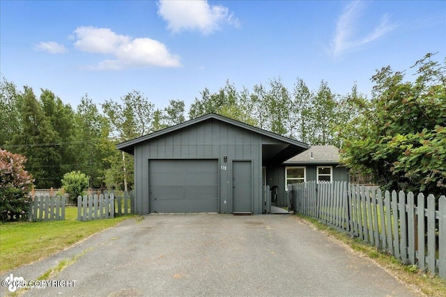 173 W Corral Ave, Soldotna, AK 99669 - view of front of house with driveway and an attached garage