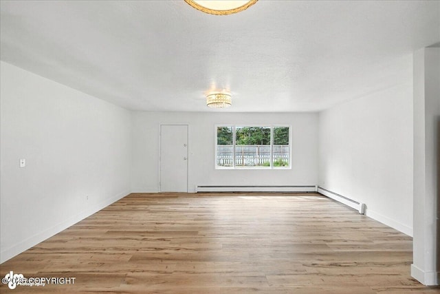 173 W Corral Ave, Soldotna, AK 99669 - unfurnished living room with wood finished floors and baseboards