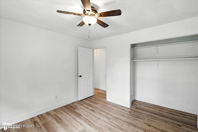 173 W Corral Ave, Soldotna, AK 99669 - unfurnished bedroom featuring wood finished floors, a closet, and a ceiling fan