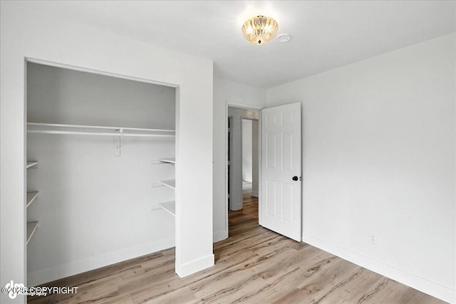 173 W Corral Ave, Soldotna, AK 99669 - unfurnished bedroom with wood finished floors and a closet