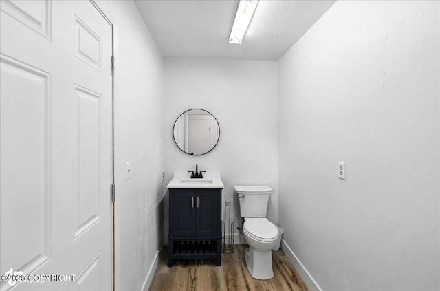 173 W Corral Ave, Soldotna, AK 99669 - half bathroom featuring wood finished floors and vanity