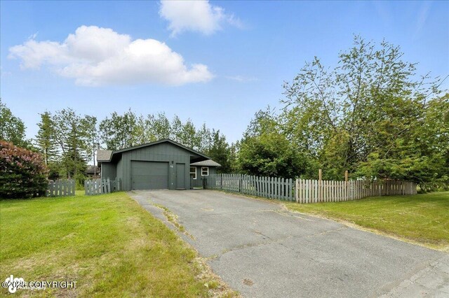 173 W Corral Ave, Soldotna, AK 99669 - garage with asphalt driveway