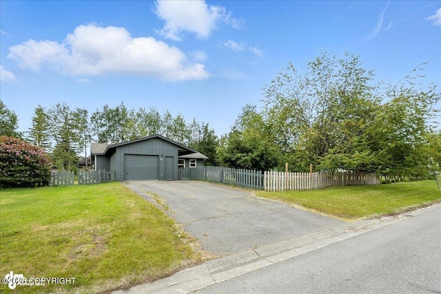 173 W Corral Ave, Soldotna, AK 99669 - view of front facade with driveway and an attached garage