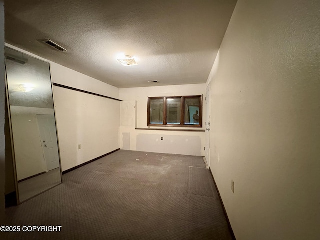 8204 E 17th Ave, Anchorage, AK 99504 - unfurnished bedroom with carpet flooring and a textured ceiling