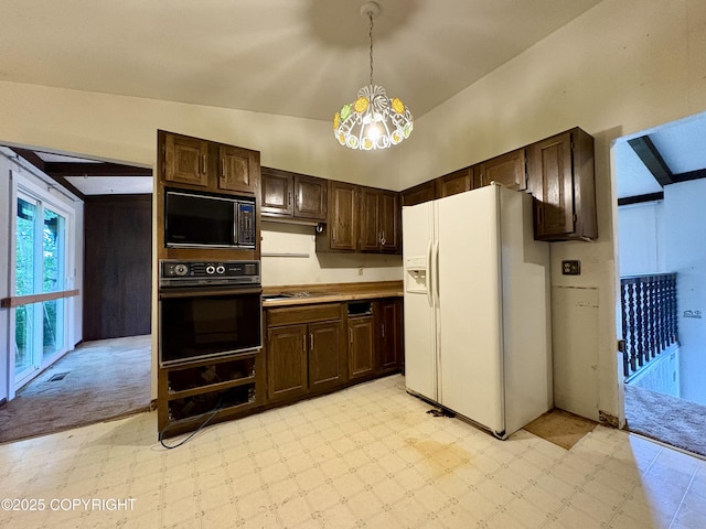 8204 E 17th Ave, Anchorage, AK 99504 - kitchen with black appliances, light floors, dark brown cabinets, a chandelier, and hanging light fixtures