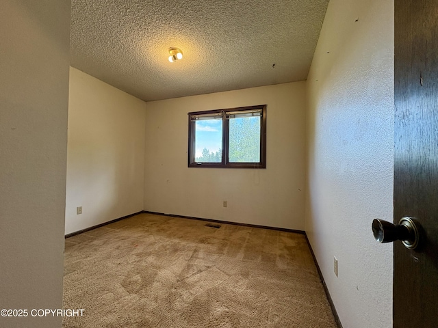 8204 E 17th Ave, Anchorage, AK 99504 - empty room with carpet floors and a textured ceiling