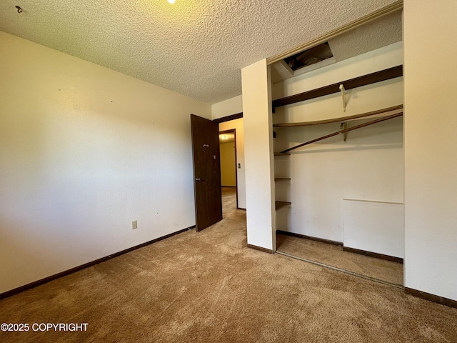 8204 E 17th Ave, Anchorage, AK 99504 - unfurnished bedroom with carpet, a textured ceiling, and a closet