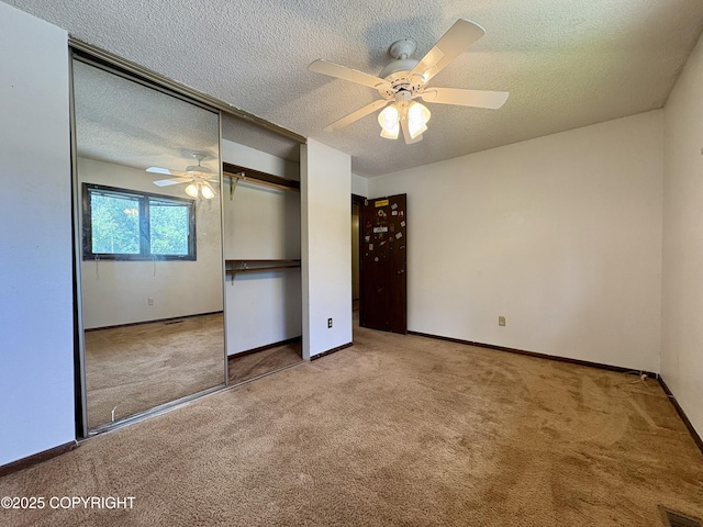 8204 E 17th Ave, Anchorage, AK 99504 - unfurnished bedroom with carpet floors, a closet, a textured ceiling, and ceiling fan