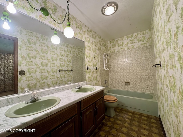 8204 E 17th Ave, Anchorage, AK 99504 - full bathroom with double vanity, washtub / shower combination, tile patterned floors, and wallpapered walls