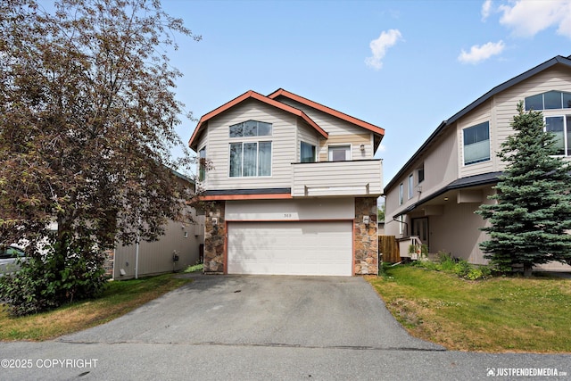 369 Breeze Ct # 13, Anchorage, AK 99515 - view of front of property featuring stone siding, driveway, and an attached garage