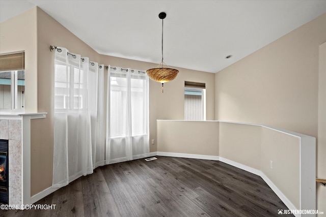 369 Breeze Ct # 13, Anchorage, AK 99515 - unfurnished dining area with wood finished floors and a fireplace