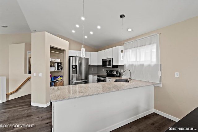 369 Breeze Ct # 13, Anchorage, AK 99515 - kitchen featuring stainless steel appliances, light stone countertops, dark wood finished floors, a peninsula, and white cabinetry