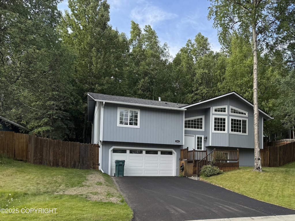 241 Mariner Dr, Anchorage, AK 99515 - bi-level home featuring asphalt driveway, a garage, and roof with shingles