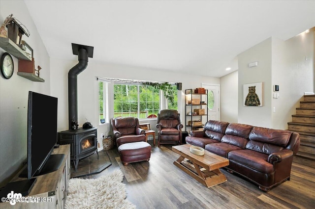 16720 E Maud Rd, Palmer, AK 99645 - living area featuring a wood stove, wood finished floors, vaulted ceiling, stairway, and recessed lighting