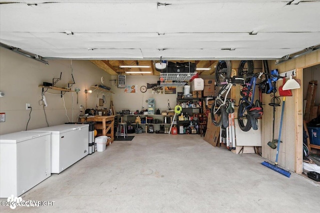 16720 E Maud Rd, Palmer, AK 99645 - garage with a workshop area and fridge