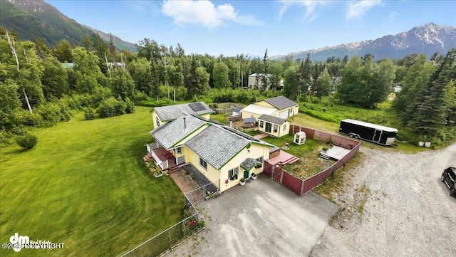 16720 E Maud Rd, Palmer, AK 99645 - view from above of property featuring a mountainous background and a heavily wooded area