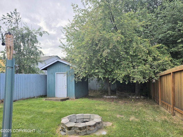 1120 China Berry Cir, Anchorage, AK 99515 - fenced backyard with a shed and a fire pit
