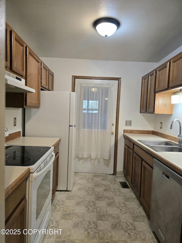 1120 China Berry Cir, Anchorage, AK 99515 - kitchen with dishwasher, under cabinet range hood, white electric stove, and light countertops