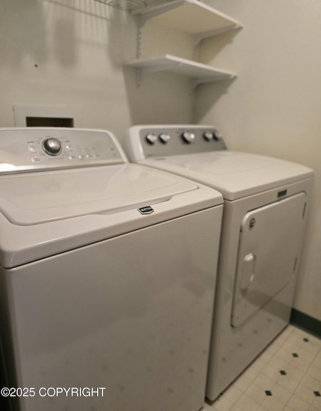 1120 China Berry Cir, Anchorage, AK 99515 - laundry area featuring separate washer and dryer and light tile patterned floors