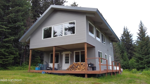 2008 Bickford Cir, Seldovia, AK 99663 - back of property with a view of trees and a wooden deck