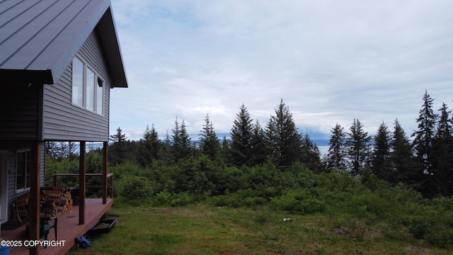 2008 Bickford Cir, Seldovia, AK 99663 - view of yard with a wooden deck and a forest view