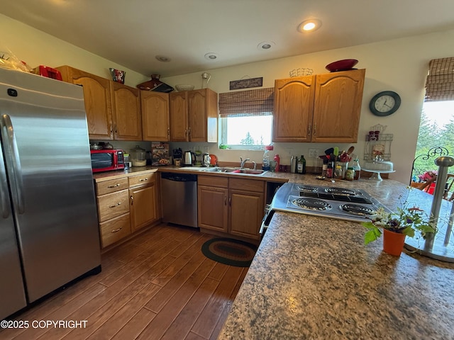 2008 Bickford Cir, Seldovia, AK 99663 - kitchen with appliances with stainless steel finishes, dark wood-style floors, recessed lighting, brown cabinetry, and a peninsula