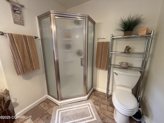 2008 Bickford Cir, Seldovia, AK 99663 - bathroom featuring a stall shower, stone tile floors, and a baseboard radiator