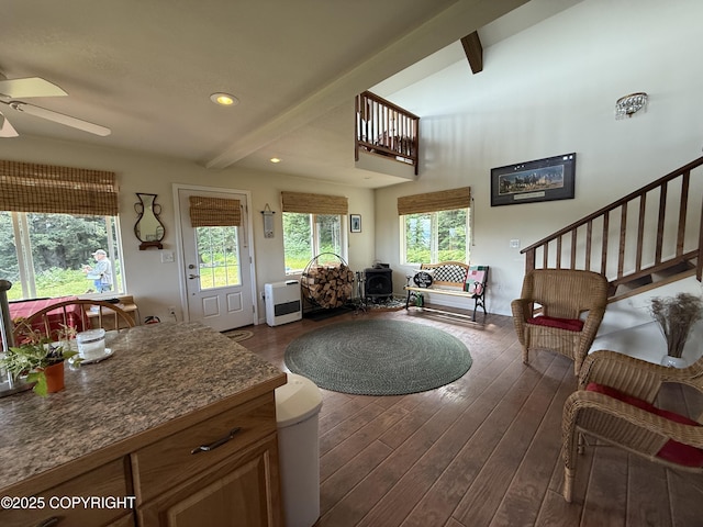 2008 Bickford Cir, Seldovia, AK 99663 - living area featuring beamed ceiling, a ceiling fan, dark wood-style floors, recessed lighting, and a wood stove