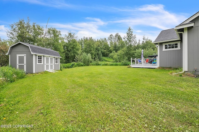 5305 N Caprice Dr, Palmer, AK 99645 - view of grassy yard featuring a shed and a wooden deck