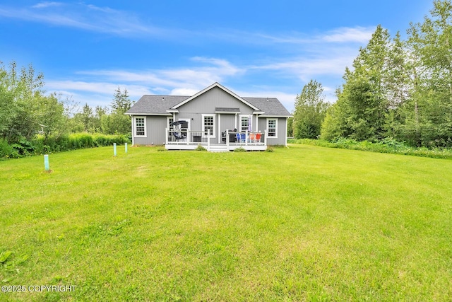 5305 N Caprice Dr, Palmer, AK 99645 - rear view of house featuring a lawn and a wooden deck