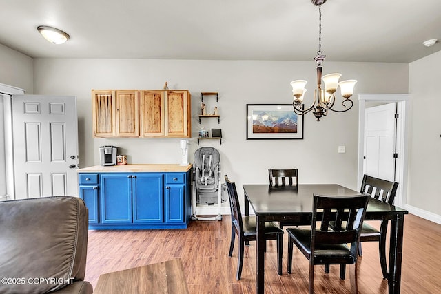 5305 N Caprice Dr, Palmer, AK 99645 - dining space featuring a chandelier and wood finished floors