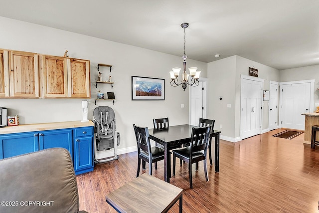 5305 N Caprice Dr, Palmer, AK 99645 - dining area featuring a chandelier and wood finished floors