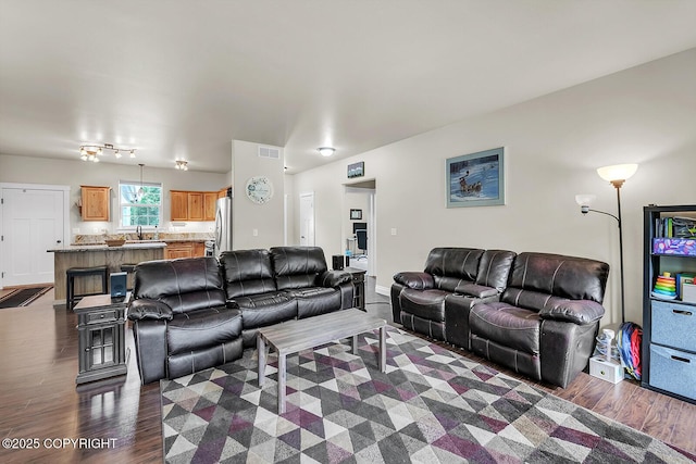 5305 N Caprice Dr, Palmer, AK 99645 - living room featuring dark wood-type flooring