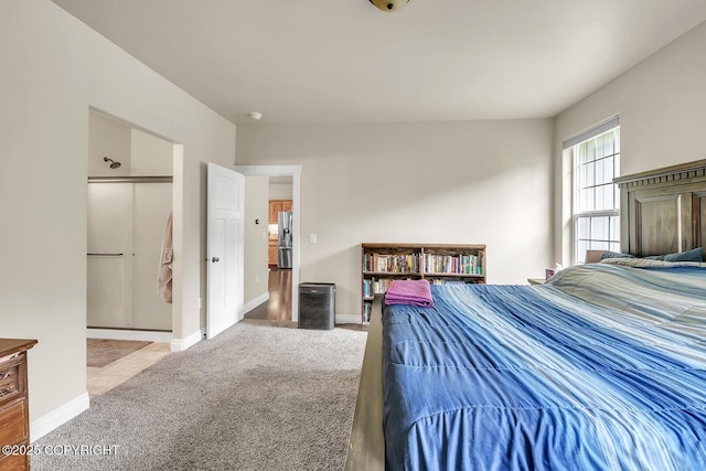 5305 N Caprice Dr, Palmer, AK 99645 - carpeted bedroom with stainless steel fridge and baseboards