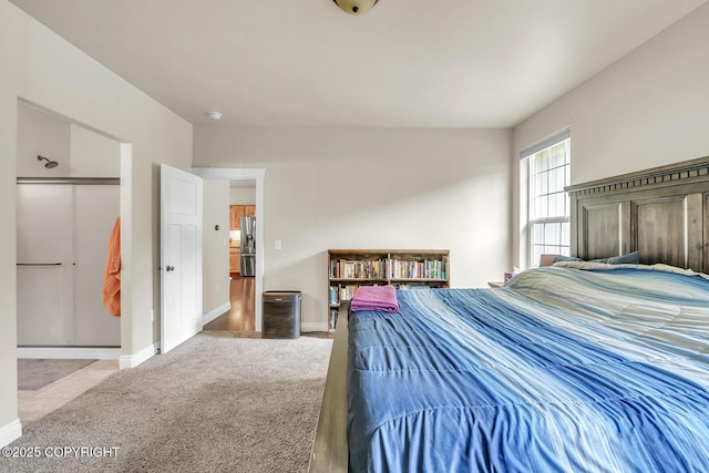 5305 N Caprice Dr, Palmer, AK 99645 - bedroom featuring stainless steel fridge with ice dispenser and carpet floors