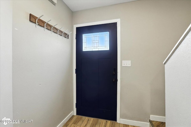 3601 Oregon Dr # 1, Anchorage, AK 99517 - entryway featuring baseboards and wood finished floors