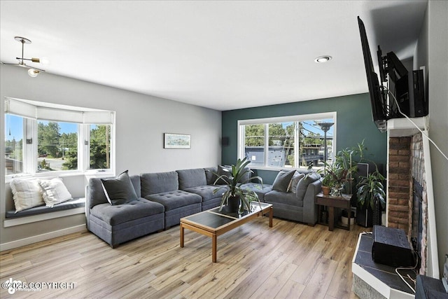 3601 Oregon Dr # 1, Anchorage, AK 99517 - living area featuring light wood-type flooring, a fireplace, and recessed lighting