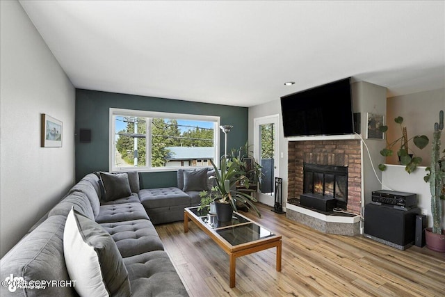 3601 Oregon Dr # 1, Anchorage, AK 99517 - living area featuring a fireplace and light wood-style floors