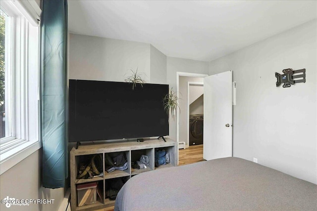 3601 Oregon Dr # 1, Anchorage, AK 99517 - bedroom featuring washer / dryer and a baseboard heating unit