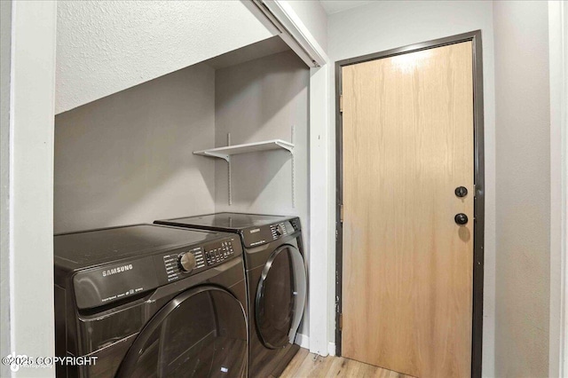3601 Oregon Dr # 1, Anchorage, AK 99517 - laundry room featuring light wood-type flooring and washing machine and dryer