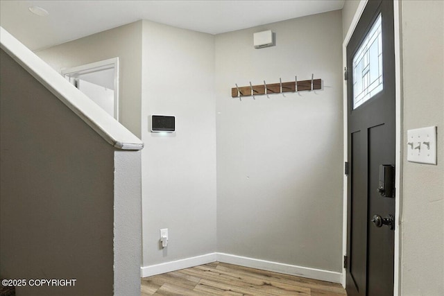 3601 Oregon Dr # 1, Anchorage, AK 99517 - hallway featuring light wood-style floors and baseboards