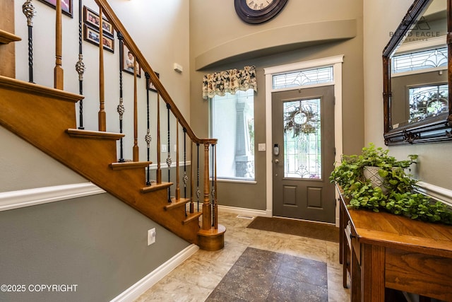 17237 E Smith Rd, Palmer, AK 99645 - entryway with plenty of natural light, stairway, and a towering ceiling