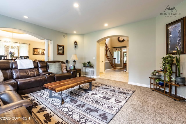 17237 E Smith Rd, Palmer, AK 99645 - living room with arched walkways, decorative columns, recessed lighting, carpet, and healthy amount of natural light