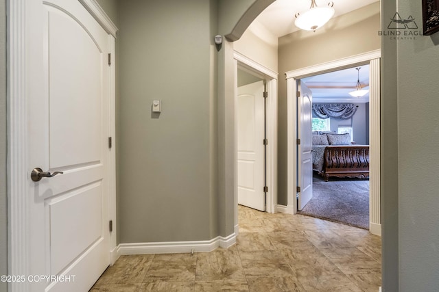 17237 E Smith Rd, Palmer, AK 99645 - corridor featuring arched walkways and baseboards